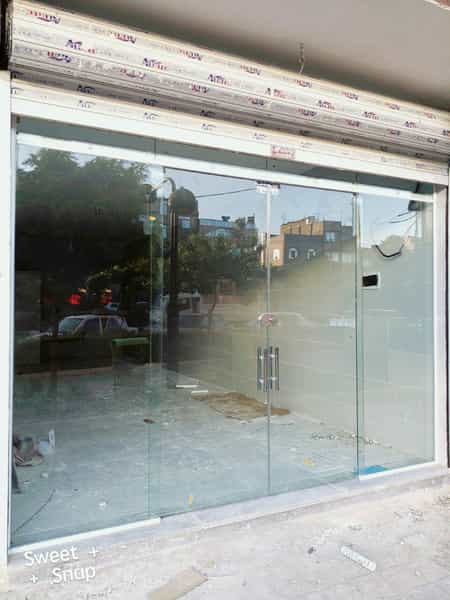 عکس شیشه ساختمانی بنائی در انقلاب مشهد